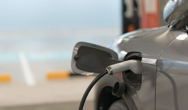 Closeup of EV charging in garage