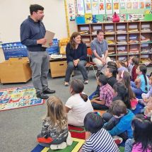 elementary students sitting in a classroom listening to a Solutions to Waste schools program lesson