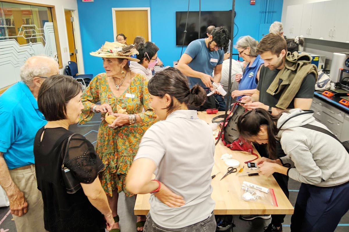 group of people at San Mateo County Fixit Clinic fixing household items