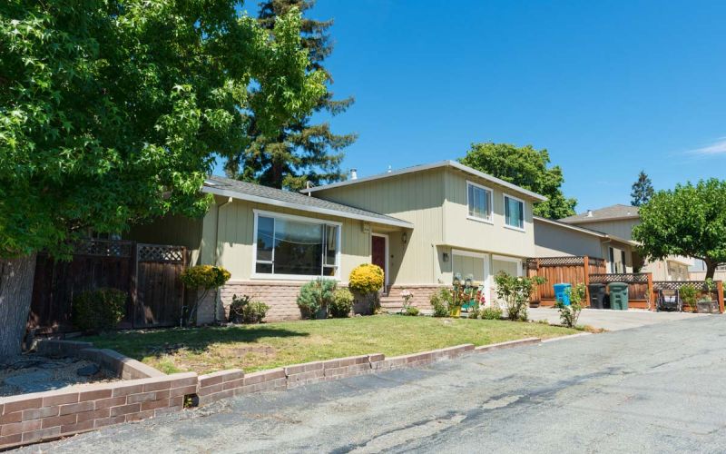 neighborhood single family home on sunny day