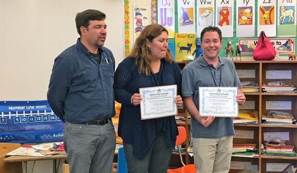 two teachers receiving Green Star Schools Award