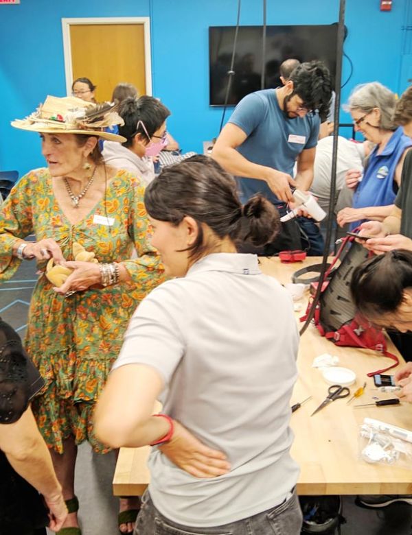 group of people at San Mateo County Fixit Clinic fixing household items