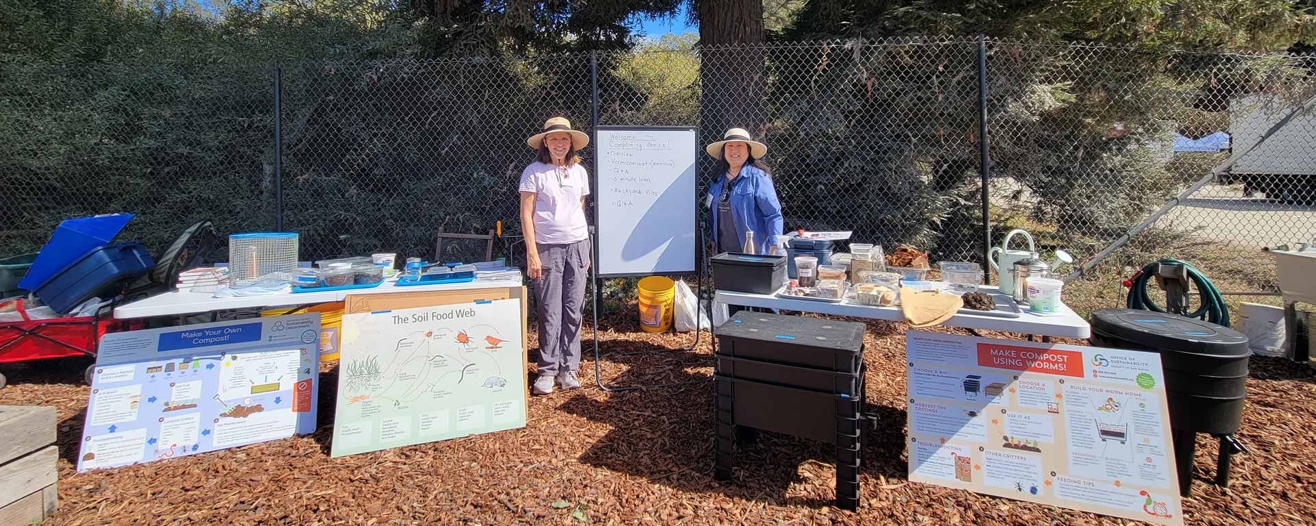 compost workshop instructors with their many instructional materials