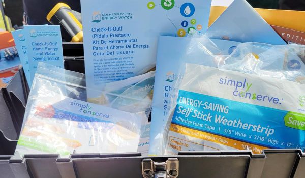 toolbox filled with Energy Toolkit energy and water efficiency supplies and guidebooks for residents of San Mateo County