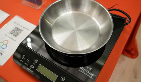 San Mateo County Sustainability Department event closeup of stainless steel pan on single burner electric induction portable stove