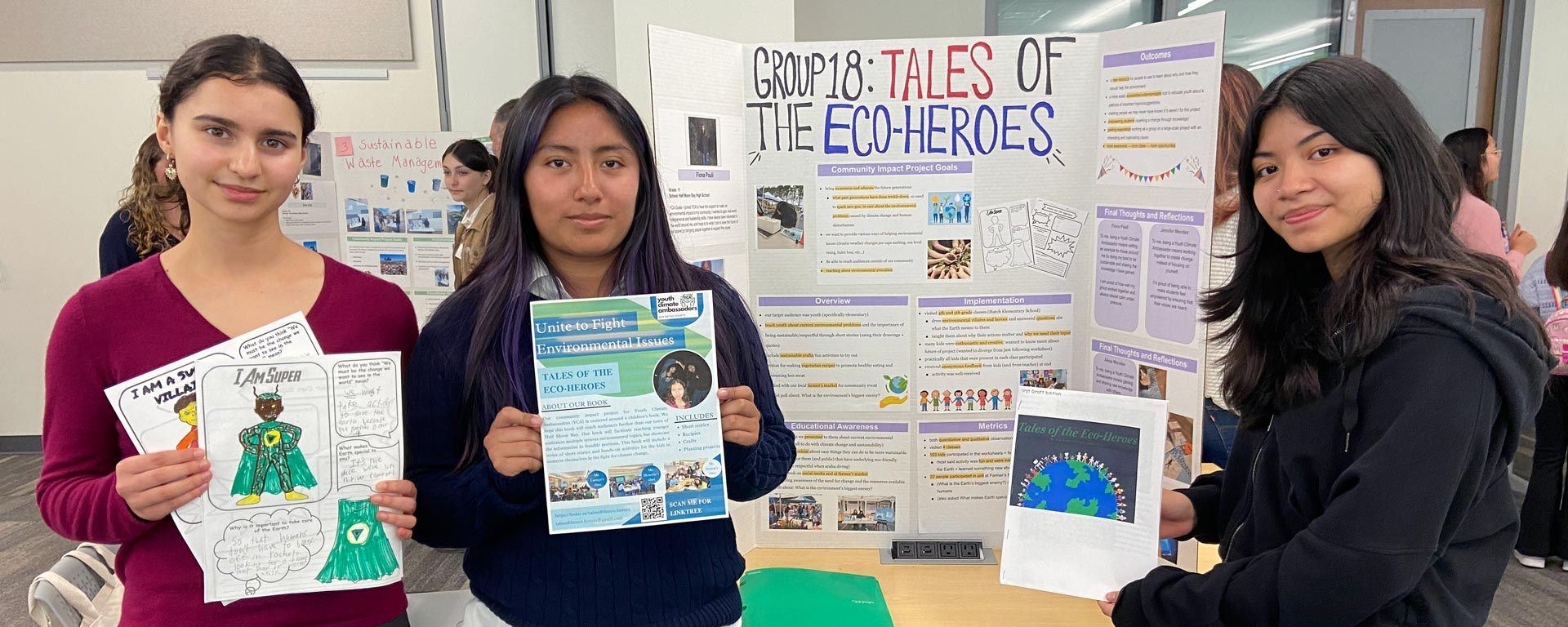 3 students standing with school project poster and book they wrote about climate change