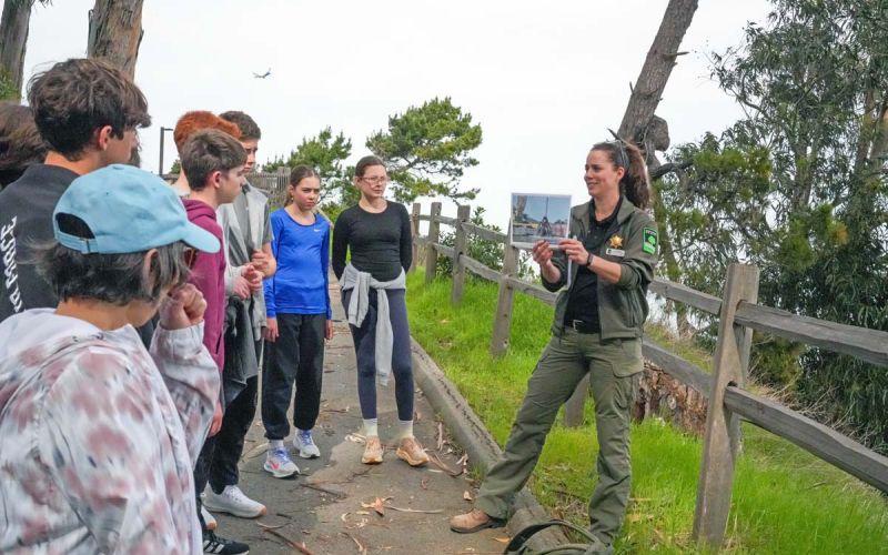 San Mateo County Park Ranger teaching group of middle school students on field trip about sea level rise