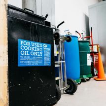 used cooking oil waste collection container in restaurant
