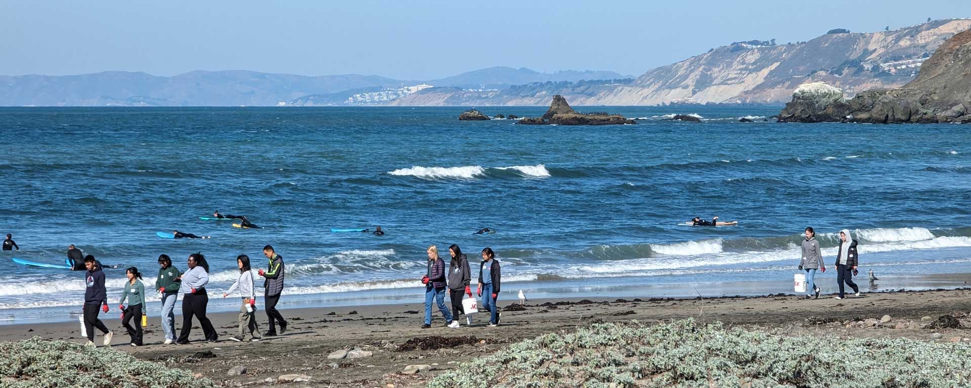 Youth Climate Ambassador Leadership Program students collecting trash on Pacifica beach