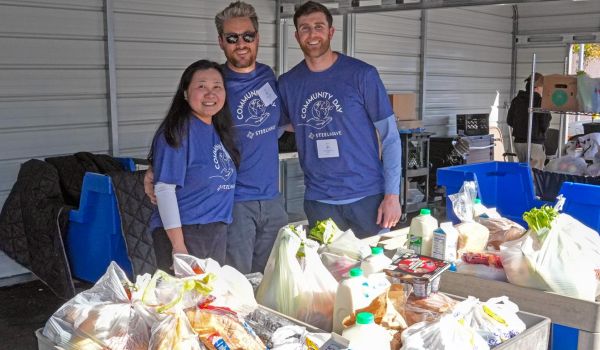 volunteers working at a food pantry with donated food