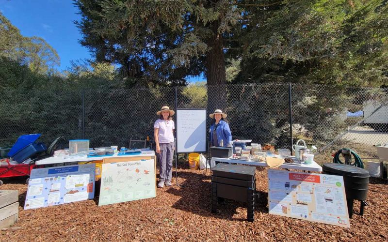 compost workshop instructors with all of their many materials at San Mateo County composting workshop