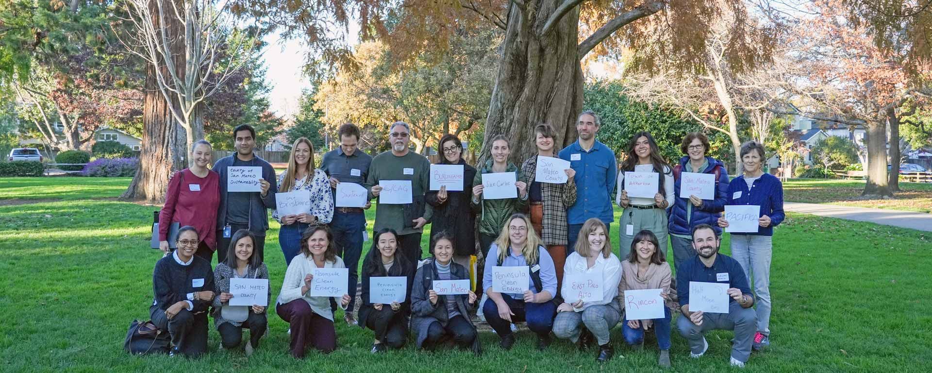 San Mateo County Sustainability Department staff group photo holding signs of jurisdictions they represent