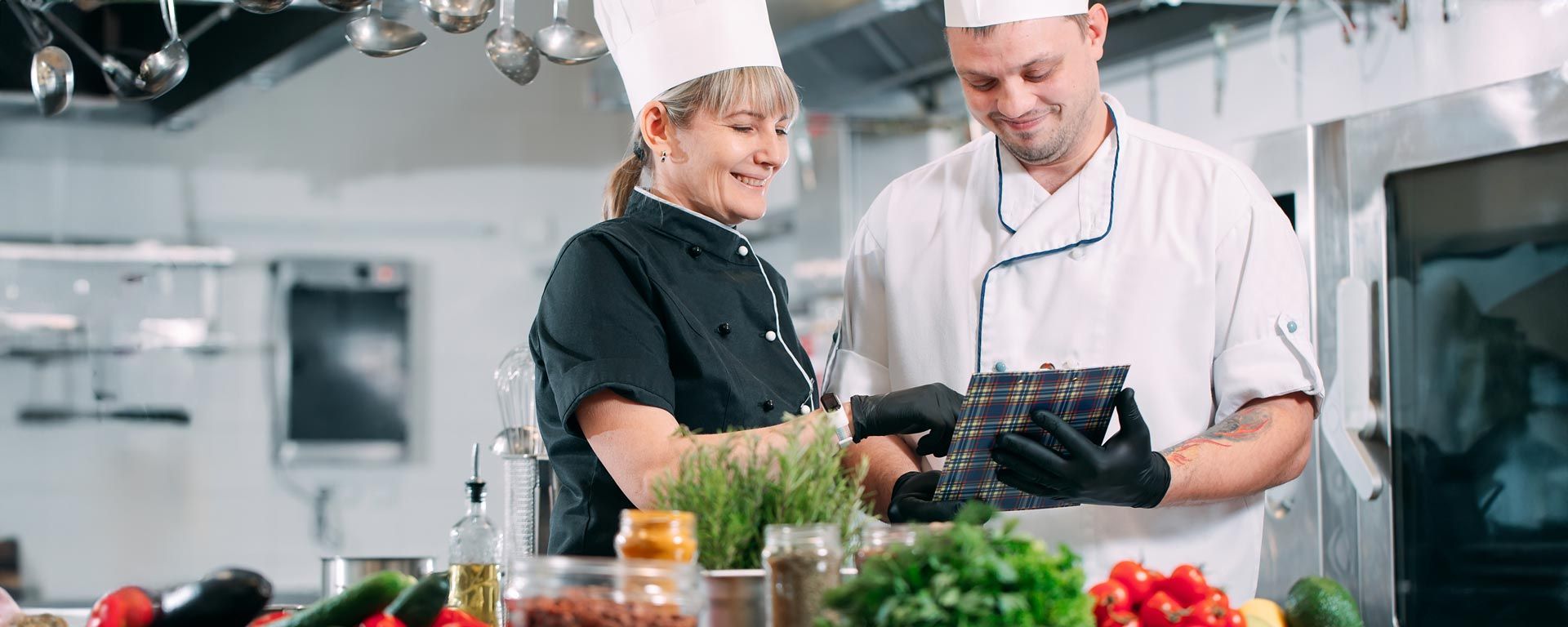 restaurant workers addressing food waste prevention