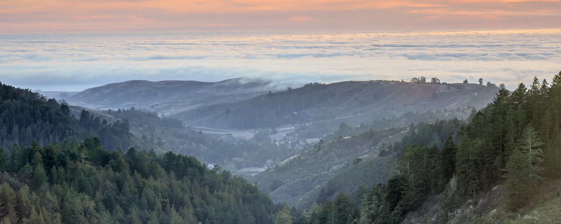 sunset view from San Mateo County hills to ocean
