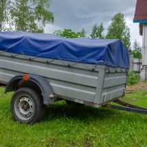 trailer with litter and debris with proper tarp covering