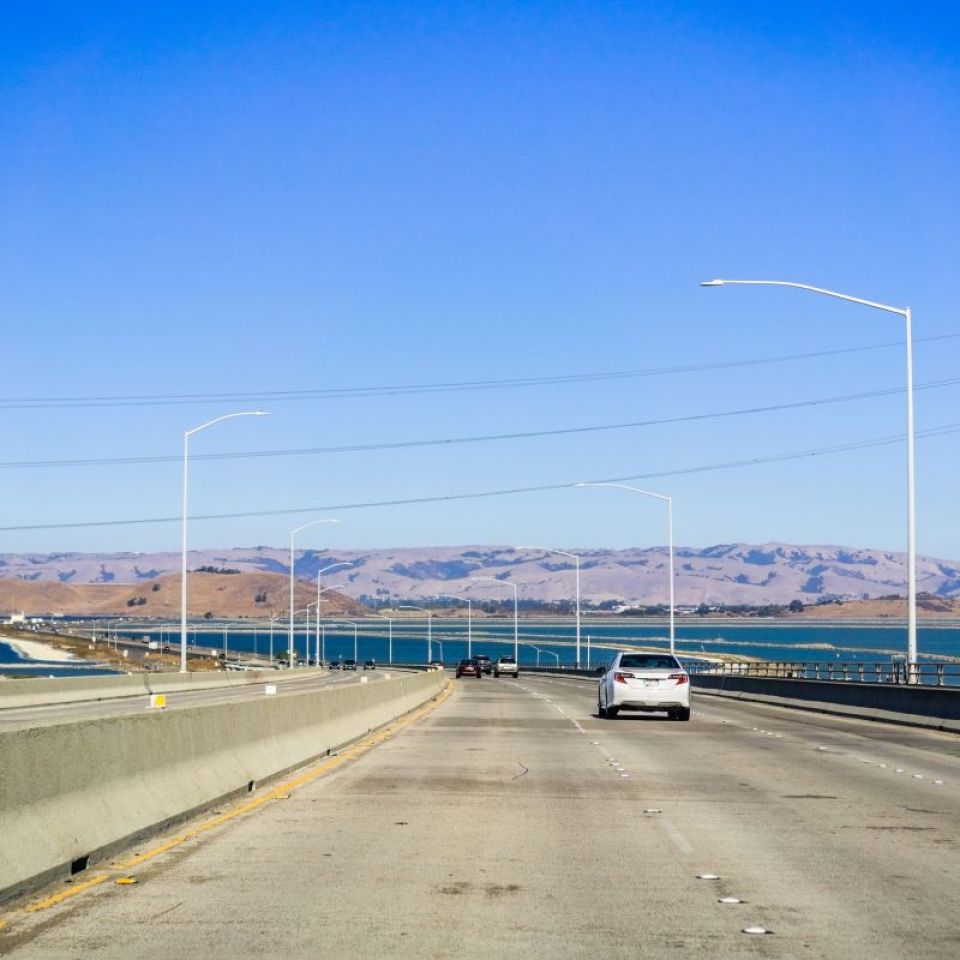 A car drives on the Dumbarton Bridge