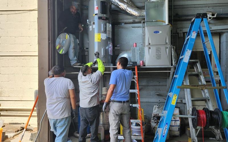 Heat pump water heater being installed in a County building