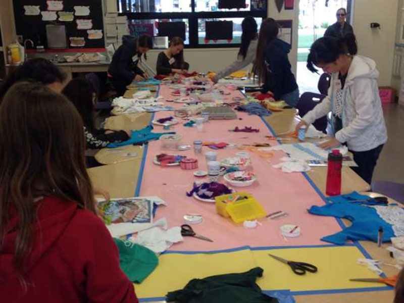 students making reusable bags