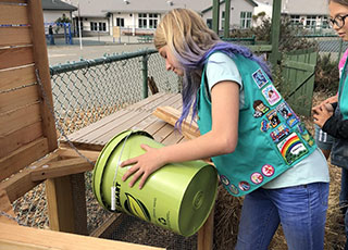 students composting at school