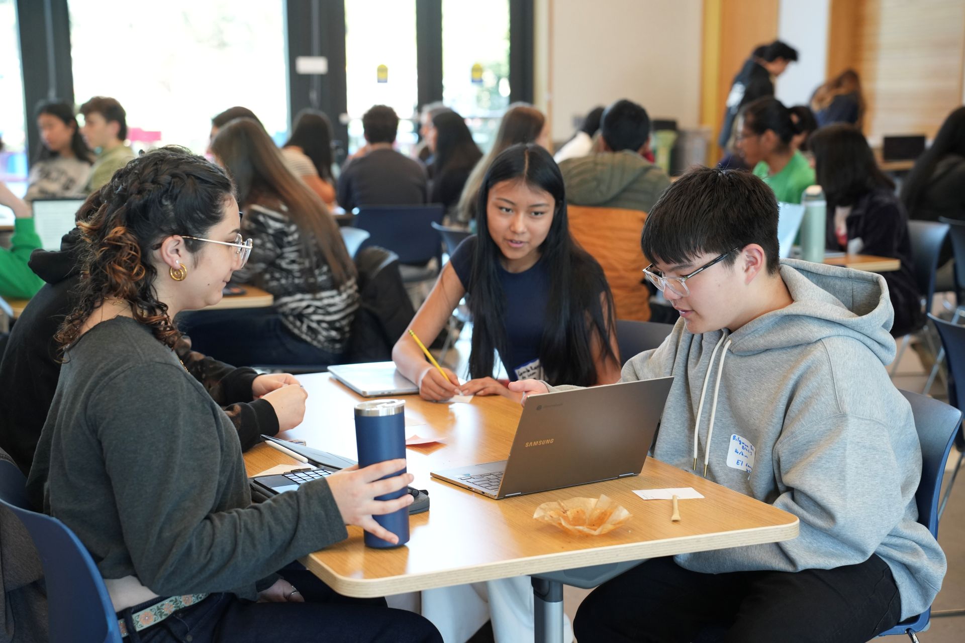 one student in Youth Climate Ambassadors program presents to two other students