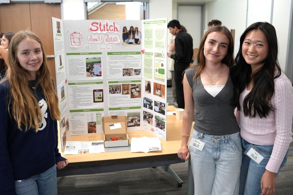 3 students posing in front of their "Stich Don't Ditch" project poster